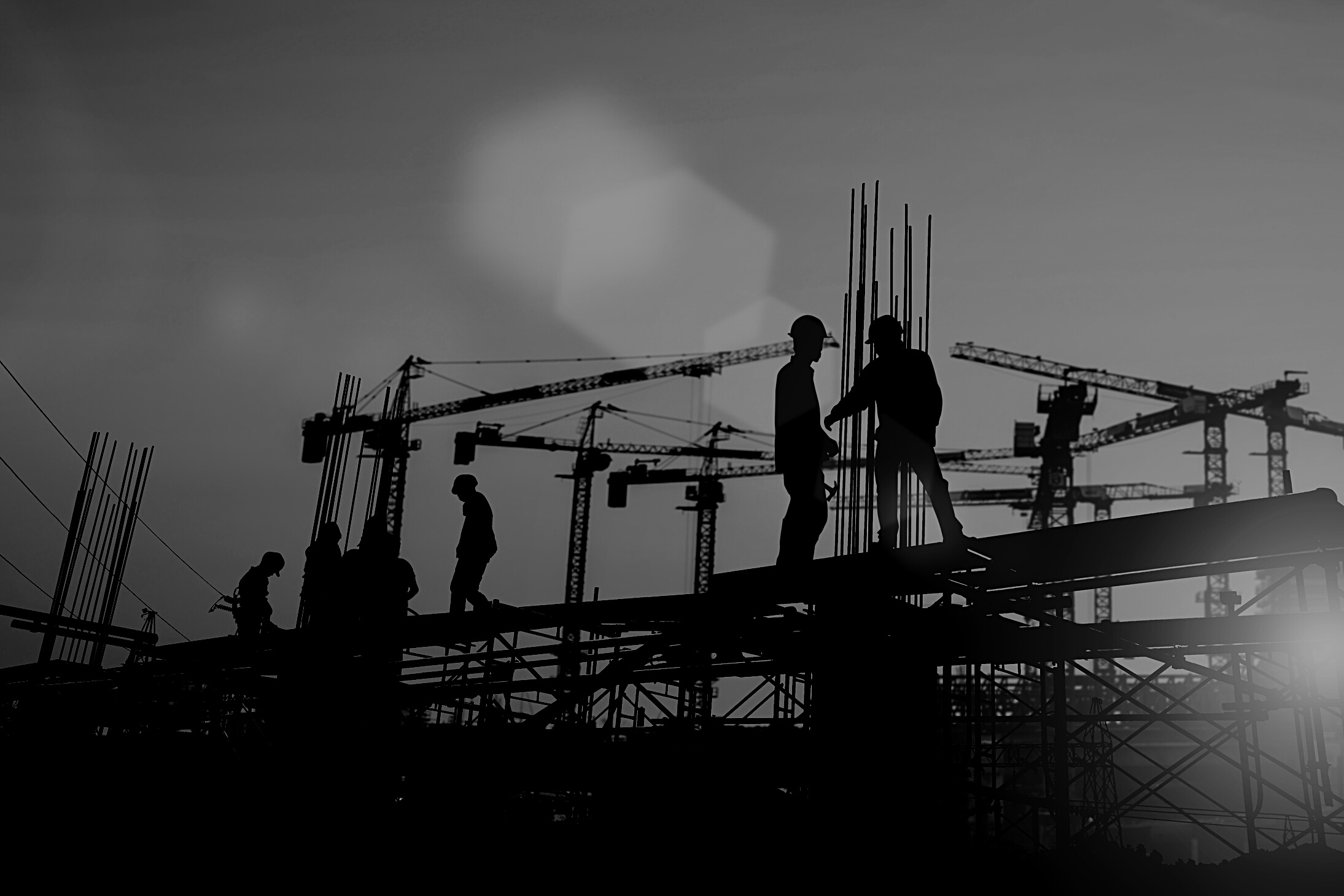 Silhouette of engineer and construction team working at site over blurred background sunset pastel for industry background with Light fair.Create from multiple reference images together.